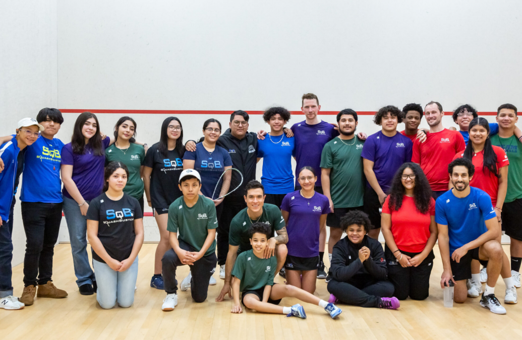 group photo of about 20 students at on indoor sports venue