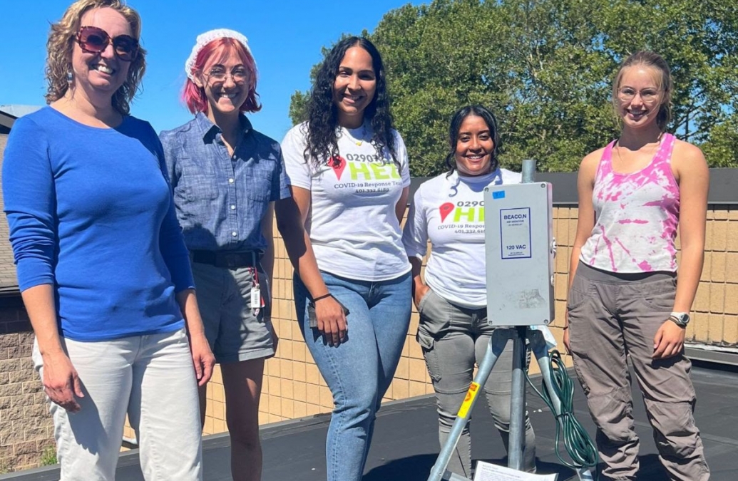 Dr. Hastings with her students setting up the air quality monitors