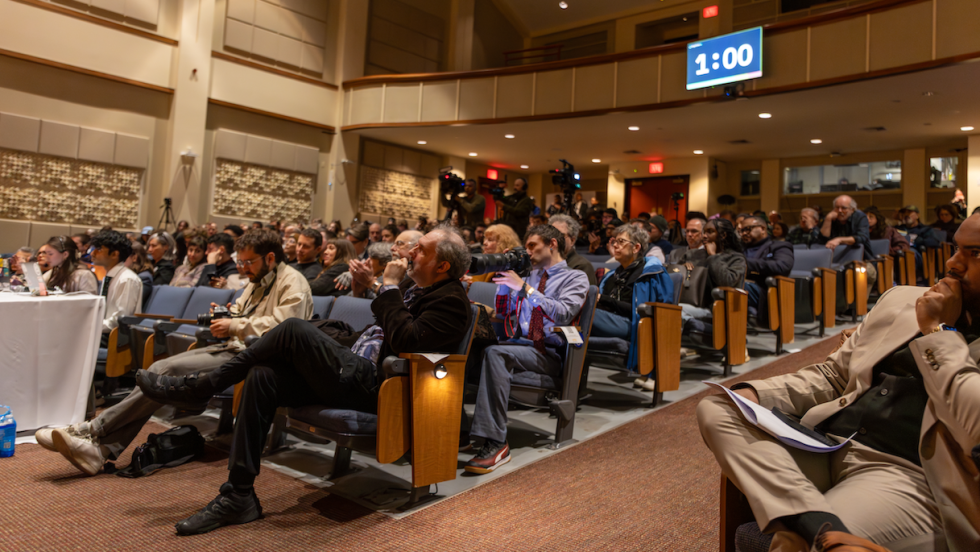 Audience members sit in rows inside the Salomon Center for Teaching during the Providence Mayoral Candidate Forum, listening to candidates speak at a student-led event hosted by Brown Votes.