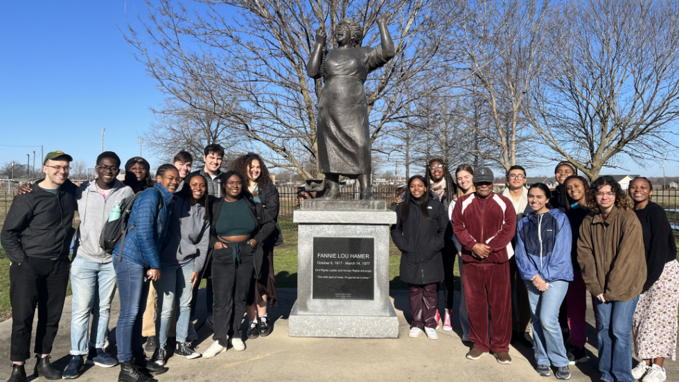 Students standing in front of Fannie Lou Hamer Statue