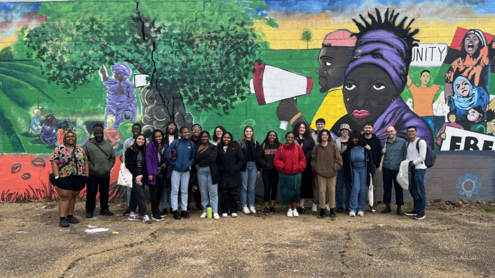 Students in front of outdoor mural